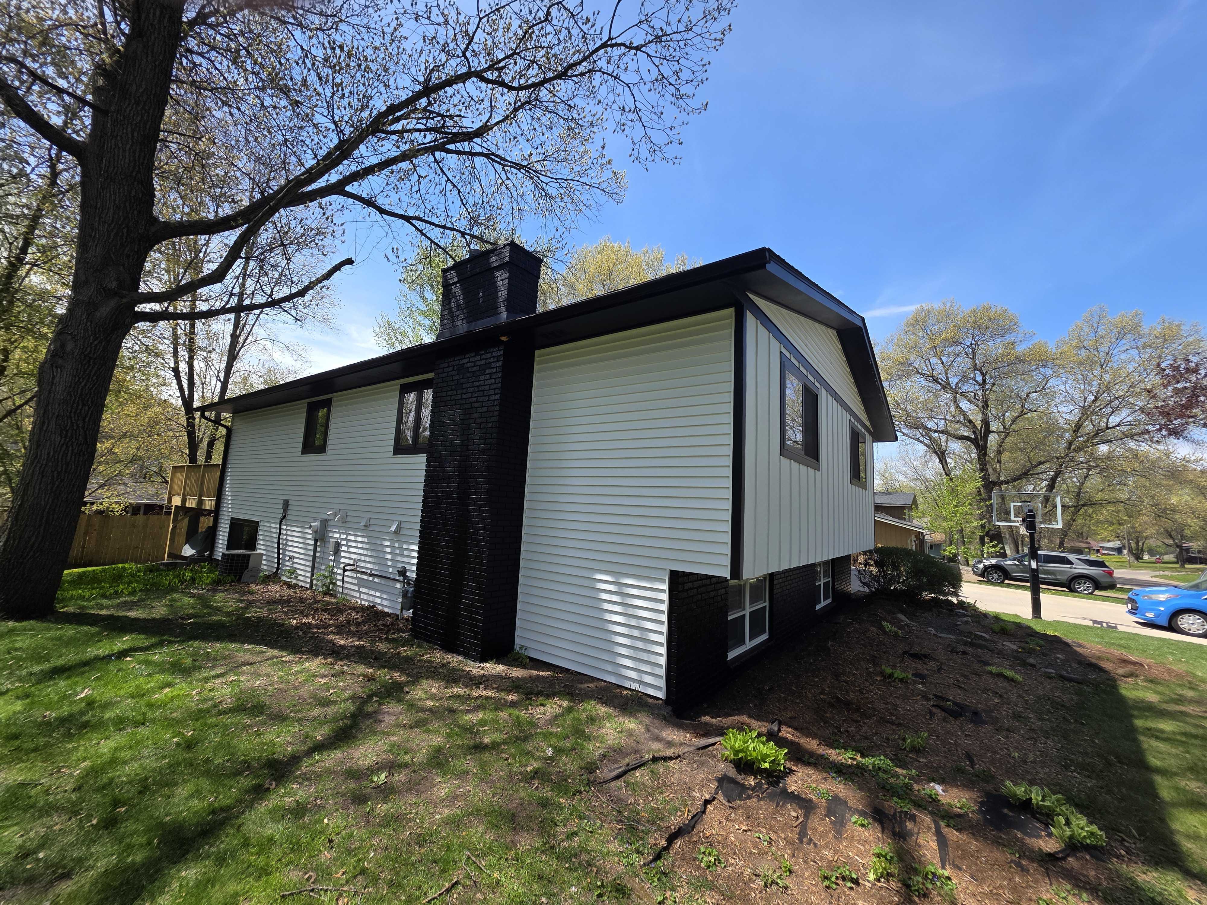 Project Bold Black and White Exterior Repaint on Wisconsin Brick-and-Siding Home image