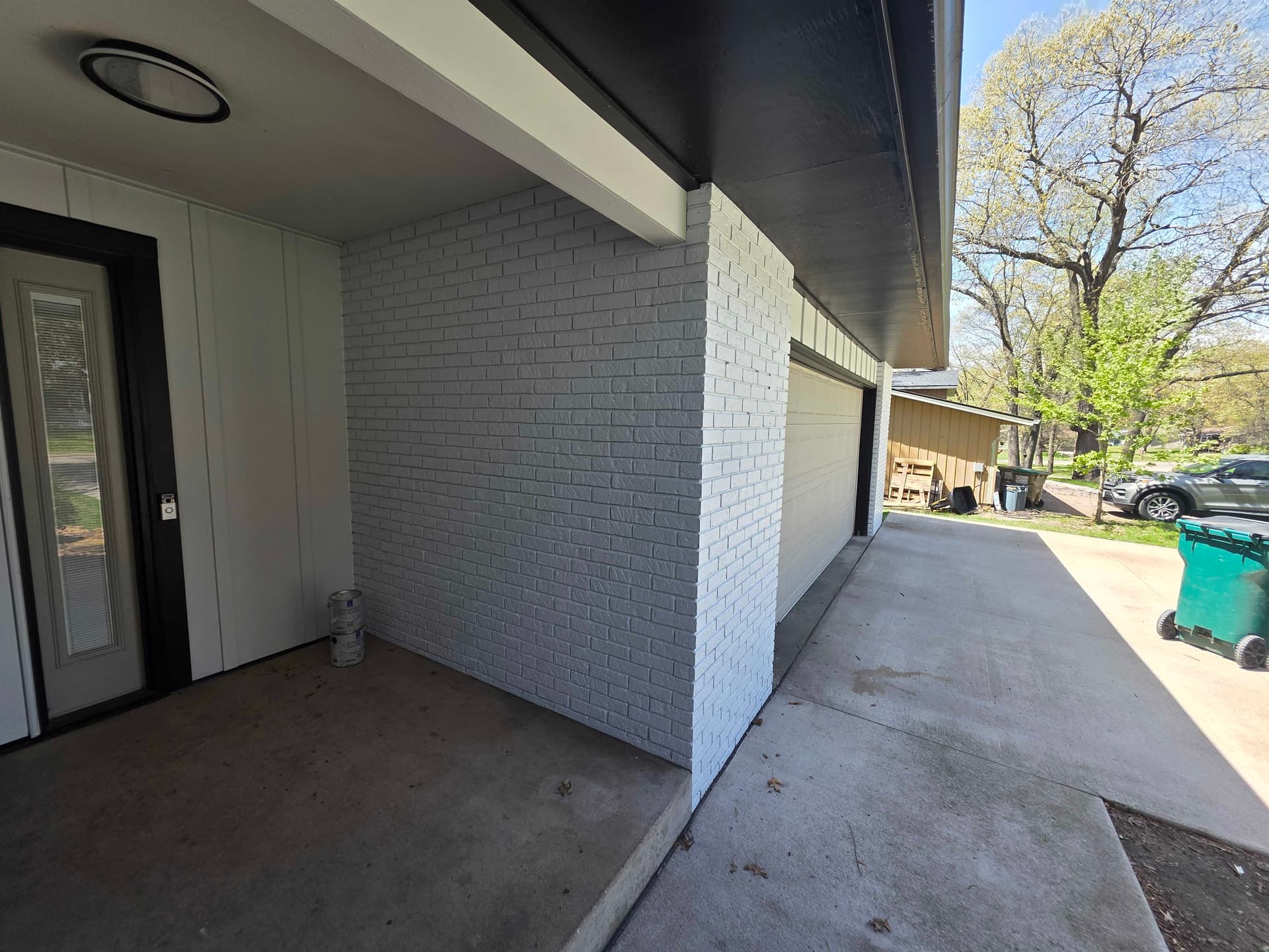 Gallery photos for Bold Black and White Exterior Repaint on Wisconsin Brick-and-Siding Home: Image #2